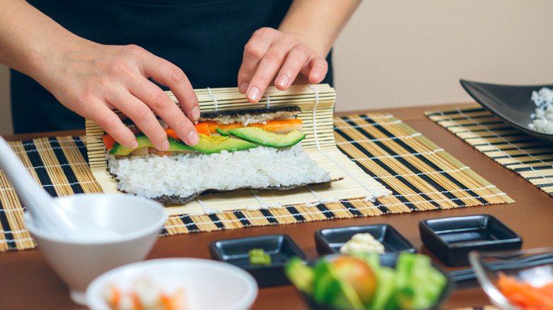 Sushi chef preparing dishes