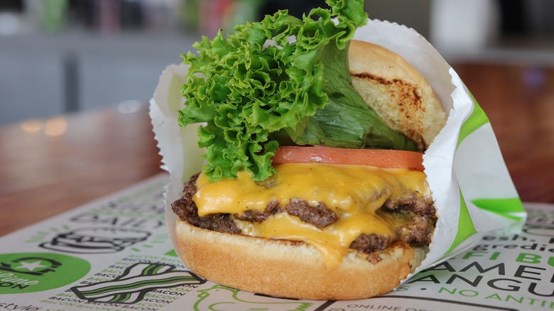 BurgerFi cheeseburger with lettuce, tomato