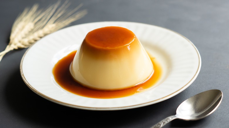 Flan on plate by spoon 
