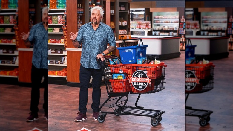 Guy Fieri with a car on the set of Guy's Grocery Games