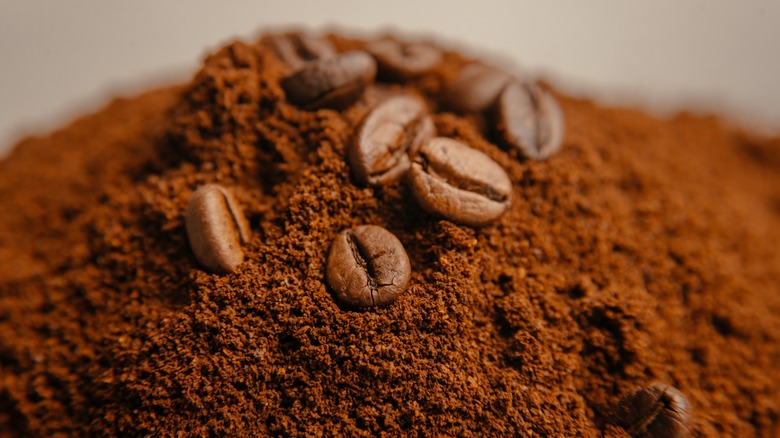 Close-up of coffee grounds and beans