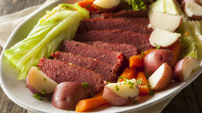 Plate of corned beef with potatoes, carrots, and cabbage
