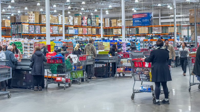 Customers queue at Costco checkout counters