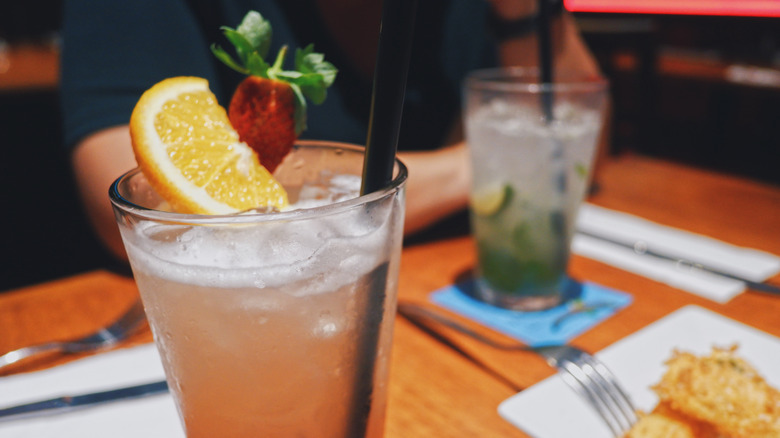 Two drinks and an appetizer on a table at TGI Fridays
