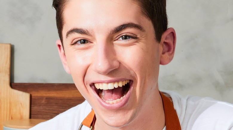 Eitan Bernath smiling in his kitchen