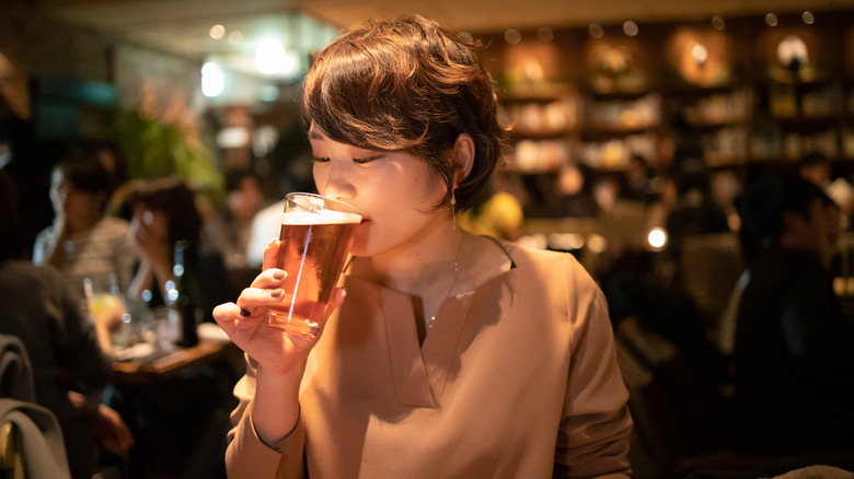 person drinking in Asian beer bar