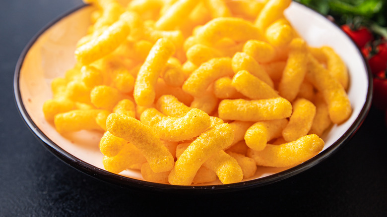 White plate of cheese puffs