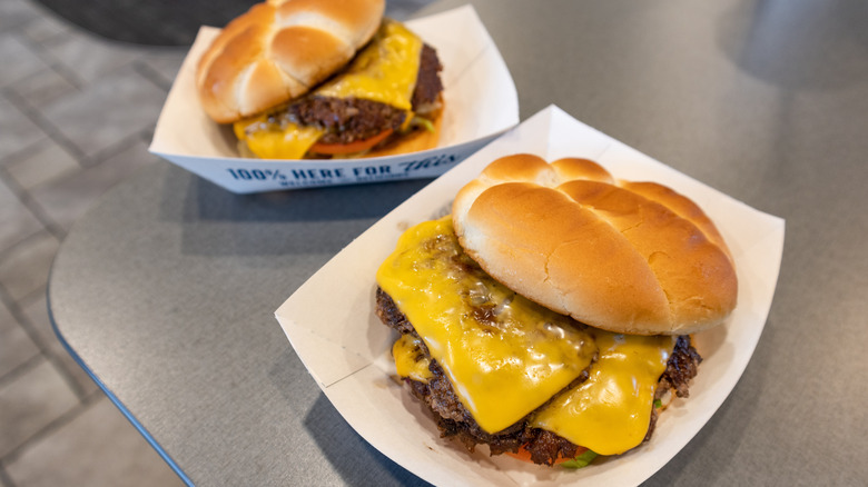 Culver's burgers sit on a table.