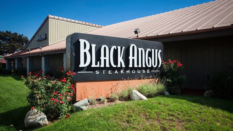 Black Angus Steakhouse sign with grass