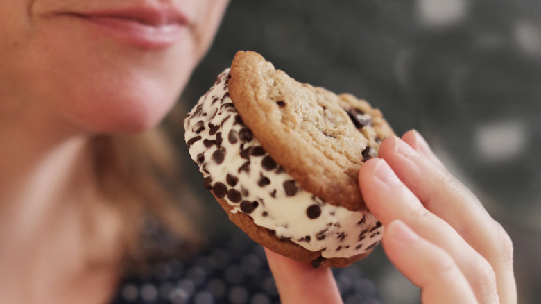 Person eating an ice cream sandwich
