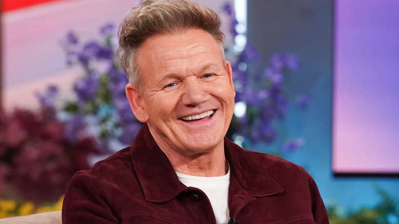 Gordon Ramsay smiling during an interview.