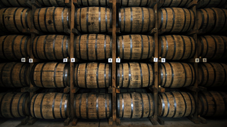 Tennessee whiskey aging in racks of barrels