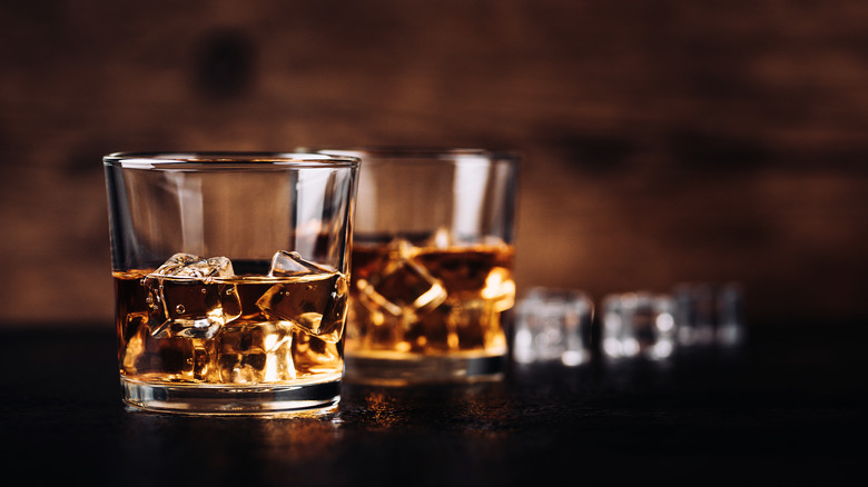 glass of bourbon on ice