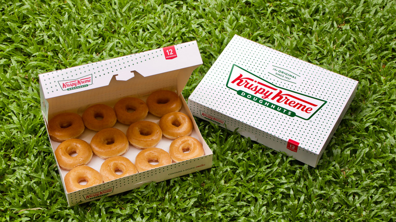 Krispy Kreme donut box on grass