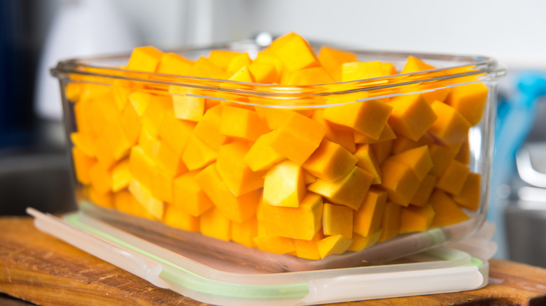 chopped butternut squash in glass container