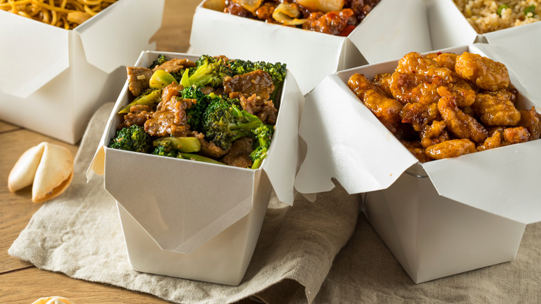 Chinese takeout boxes full of food