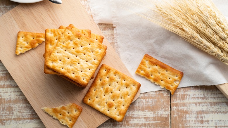 square crackers stacked on board
