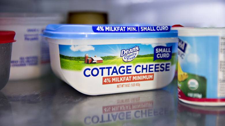 Container of cottage cheese in fridge