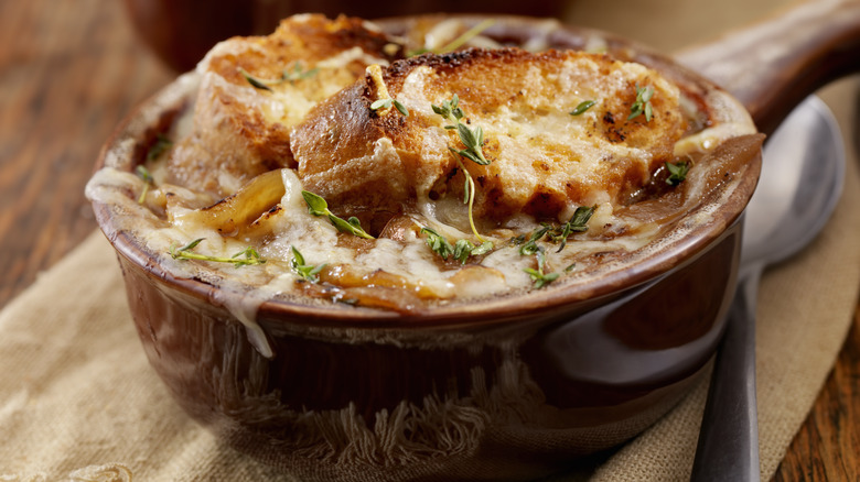 French onion soup in bowl with spoon