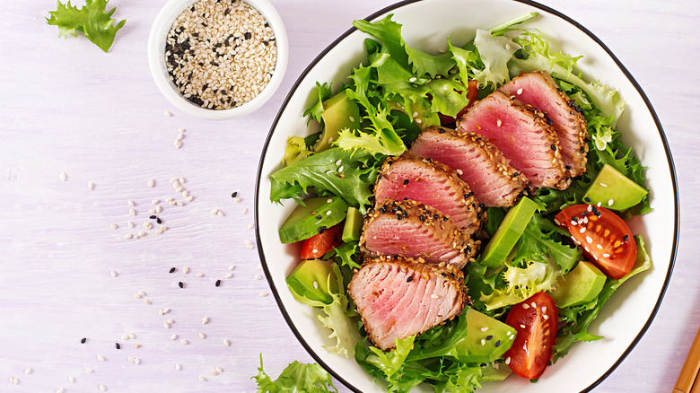Sliced tuna steak in salad
