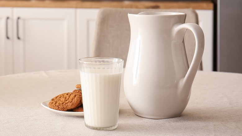 jug and glass of milk on table