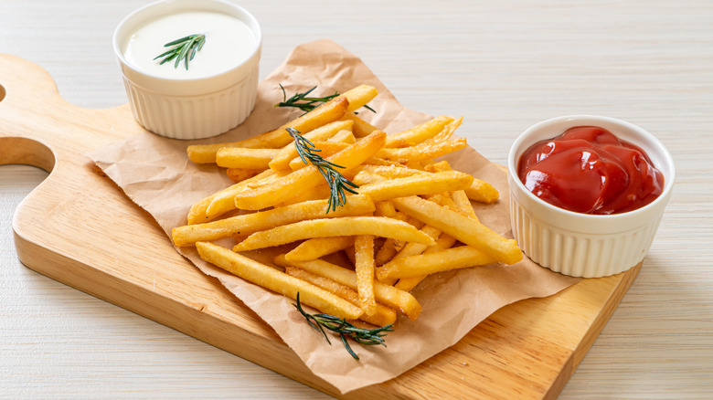 french fries with condiments