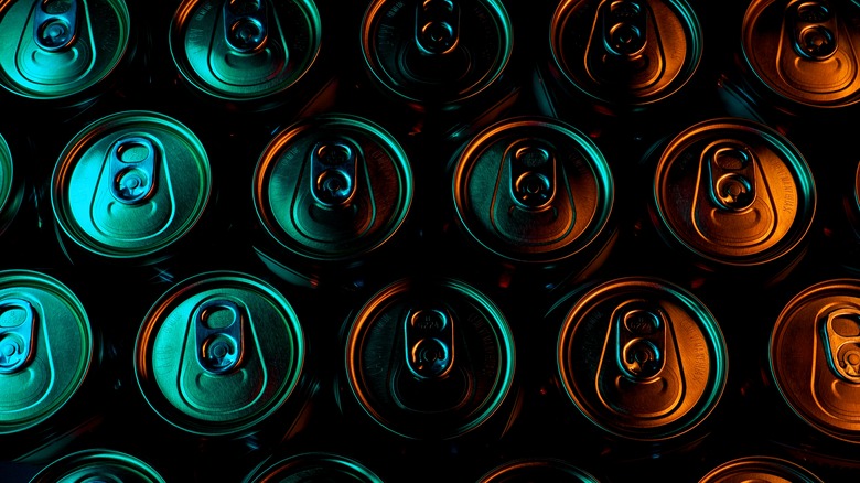 beer cans under colored lighting