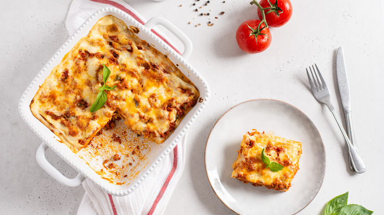 Lasagna in dish, on plate