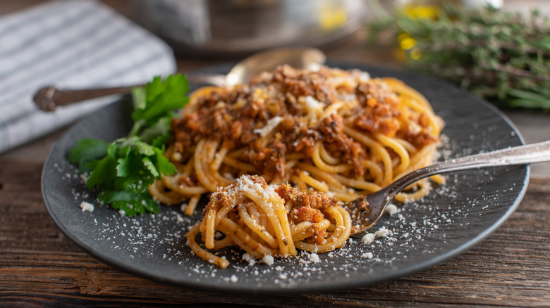 Plate of spaghetti bolognese with a fork