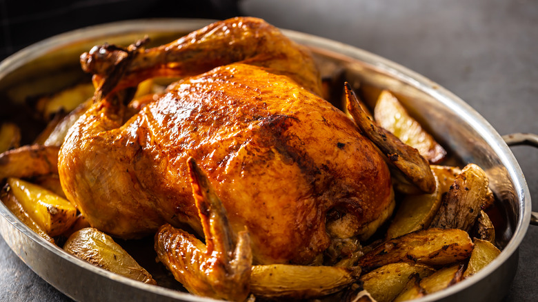 roast chicken cooked with potatoes
