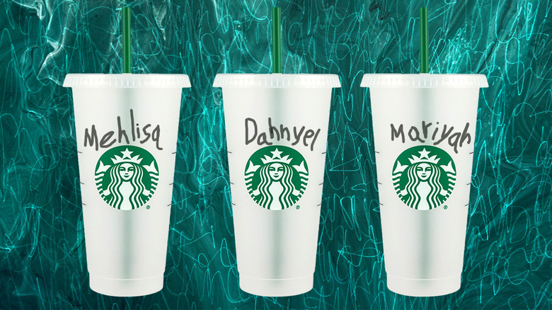 Three Starbucks cups with misspelled written names
