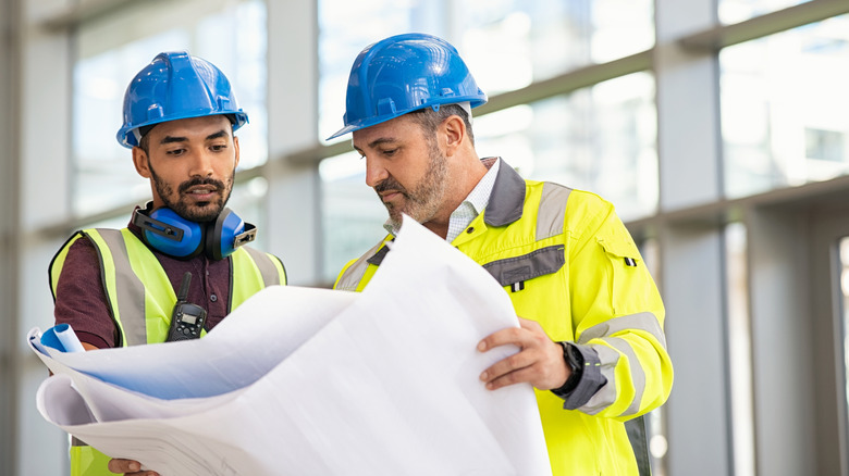 engineers checking design papers