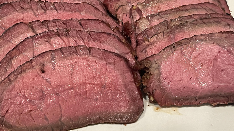top loin roast, freshly sliced and sitting on a platter