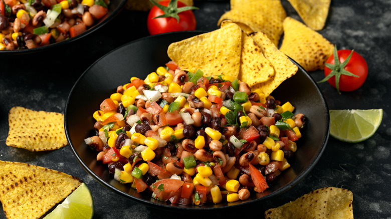 bowl of corn salad dip and tortilla chips