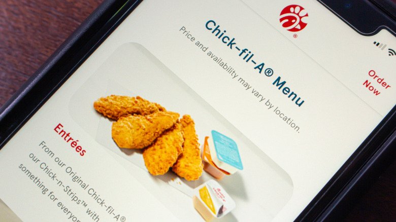 Smart phone screen showing Chick-fil-A menu on app with chicken fingers and sauce