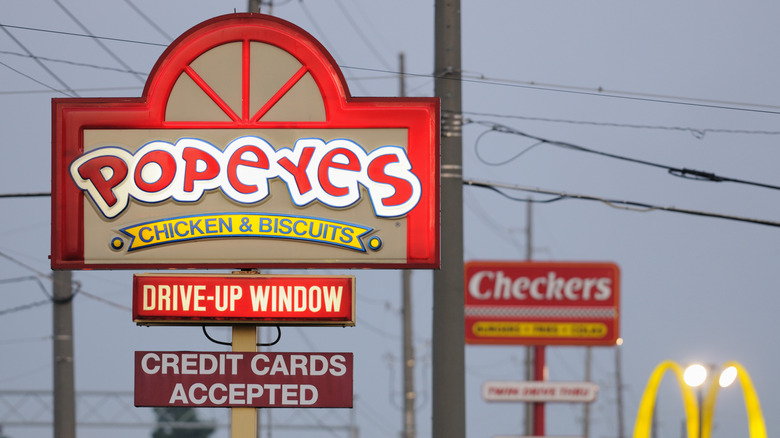 A Popeyes Chicken and Biscuits sign