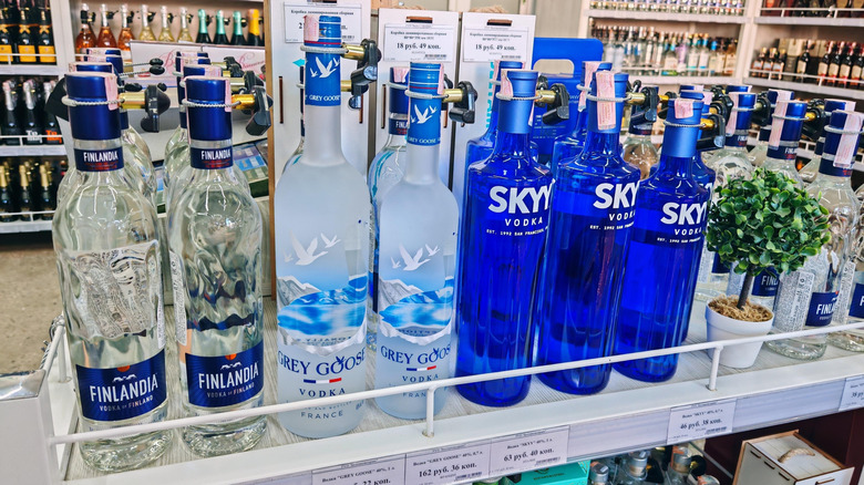 Bottles of Finlandia, Gray Goose, and Skyy Vodka on a Shelf
