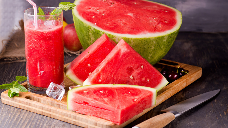 Watermelon slices with a glass of watermelon juice