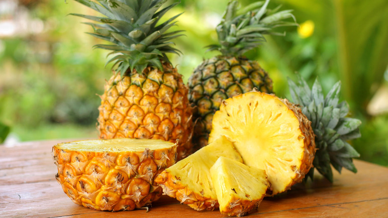 halved and whole pineapples