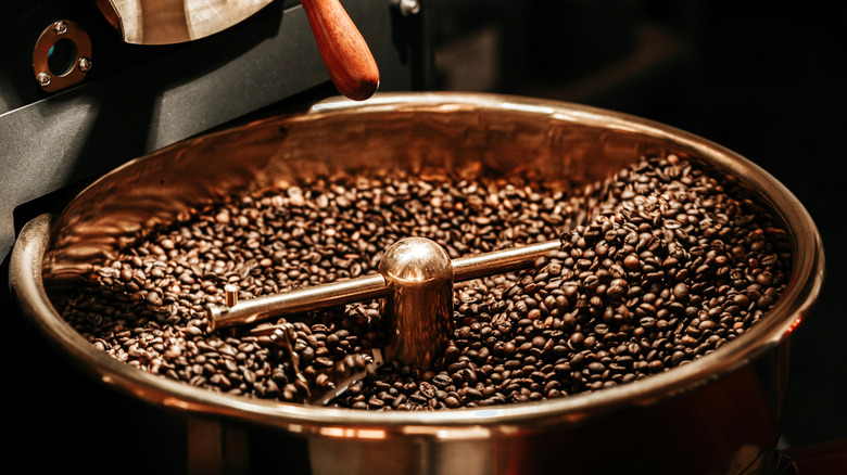 Coffee beans in a bronze roasting machine