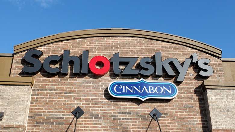 Schlotzsky's restaurant sign next to Cinnabon sign