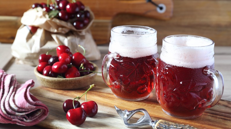 mugs of cherry sour beer