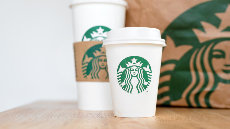 Starbucks coffee cups on counter