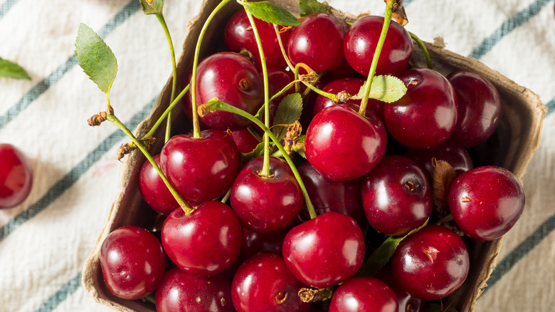 Bing cherries in a produce carton