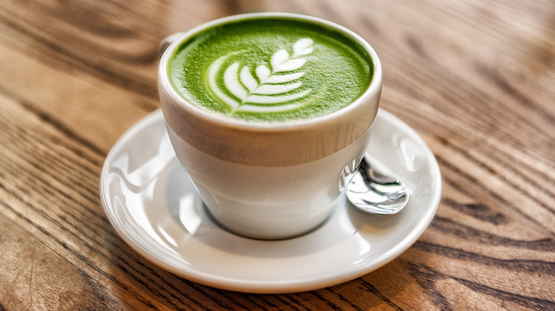 Matcha in white cup on counter