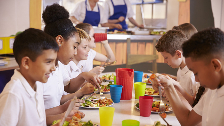 children eat in school cafeteria