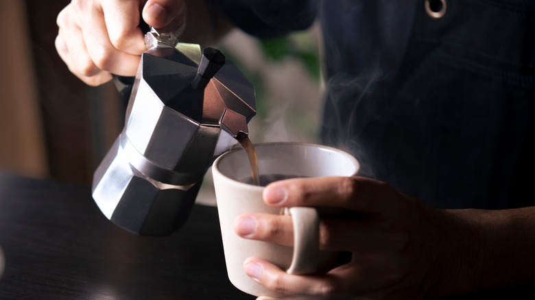 Pouring coffee into cup