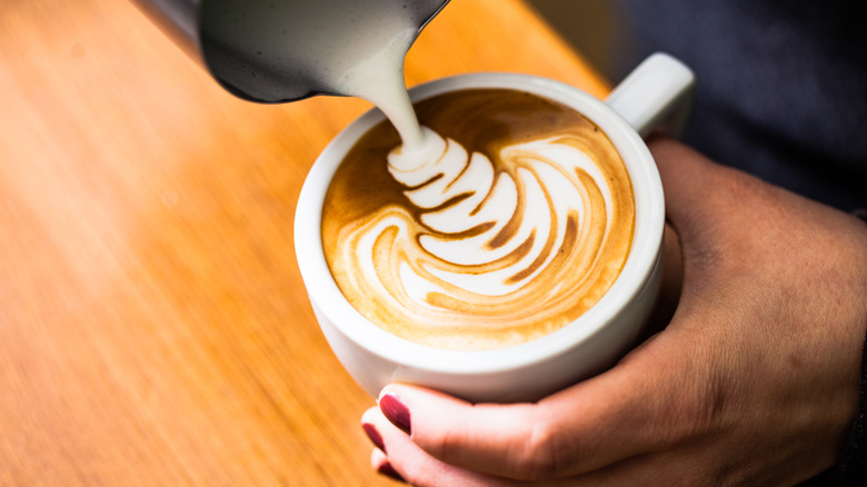 barista creating latte art 