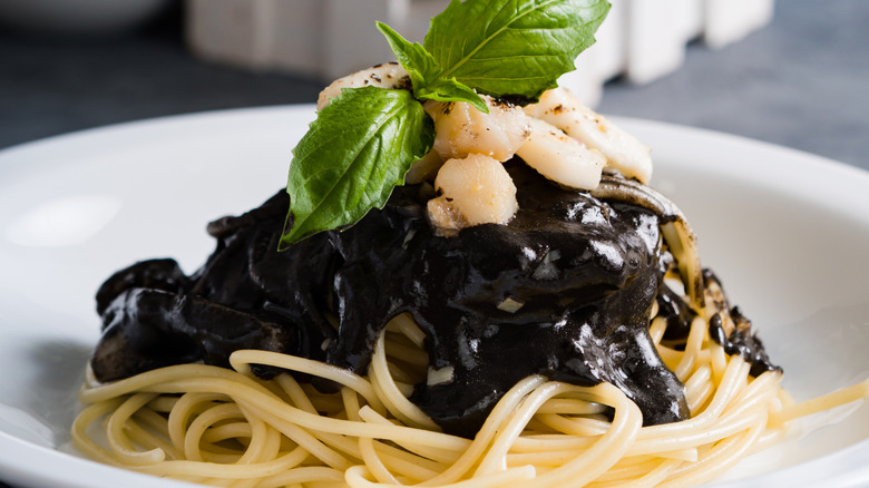 squid ink sauce with spaghetti and scallops