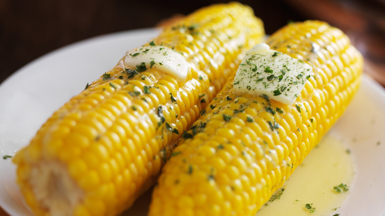 Corn on the cob with melted herb butter